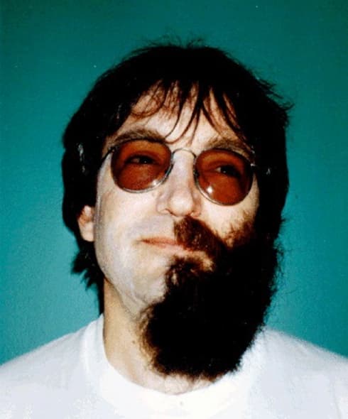 Adult male with one half of his beard removed Adult male with one half of his beard removed