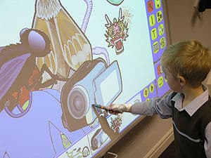A student using an Interactive Whiteboard A student using an Interactive Whiteboard