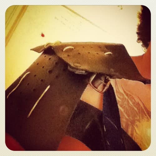 First stage of shoulder armor - an old belt, strip of cloth and leather tied on with aluminium wire First stage of shoulder armor - an old belt, strip of cloth and leather tied on with aluminium wire