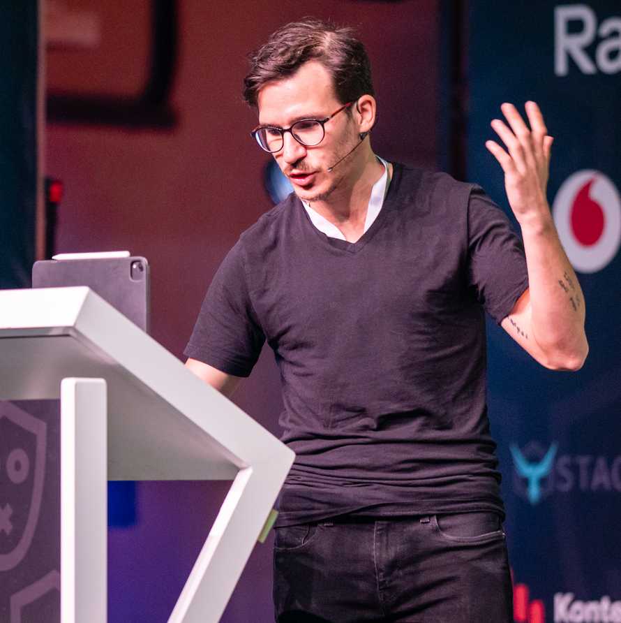 Swizec speaking at React Summit in Amsterdam