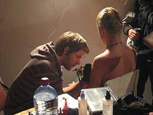 Tattoo artist at Zvērā Festival 2009 (Latvia).